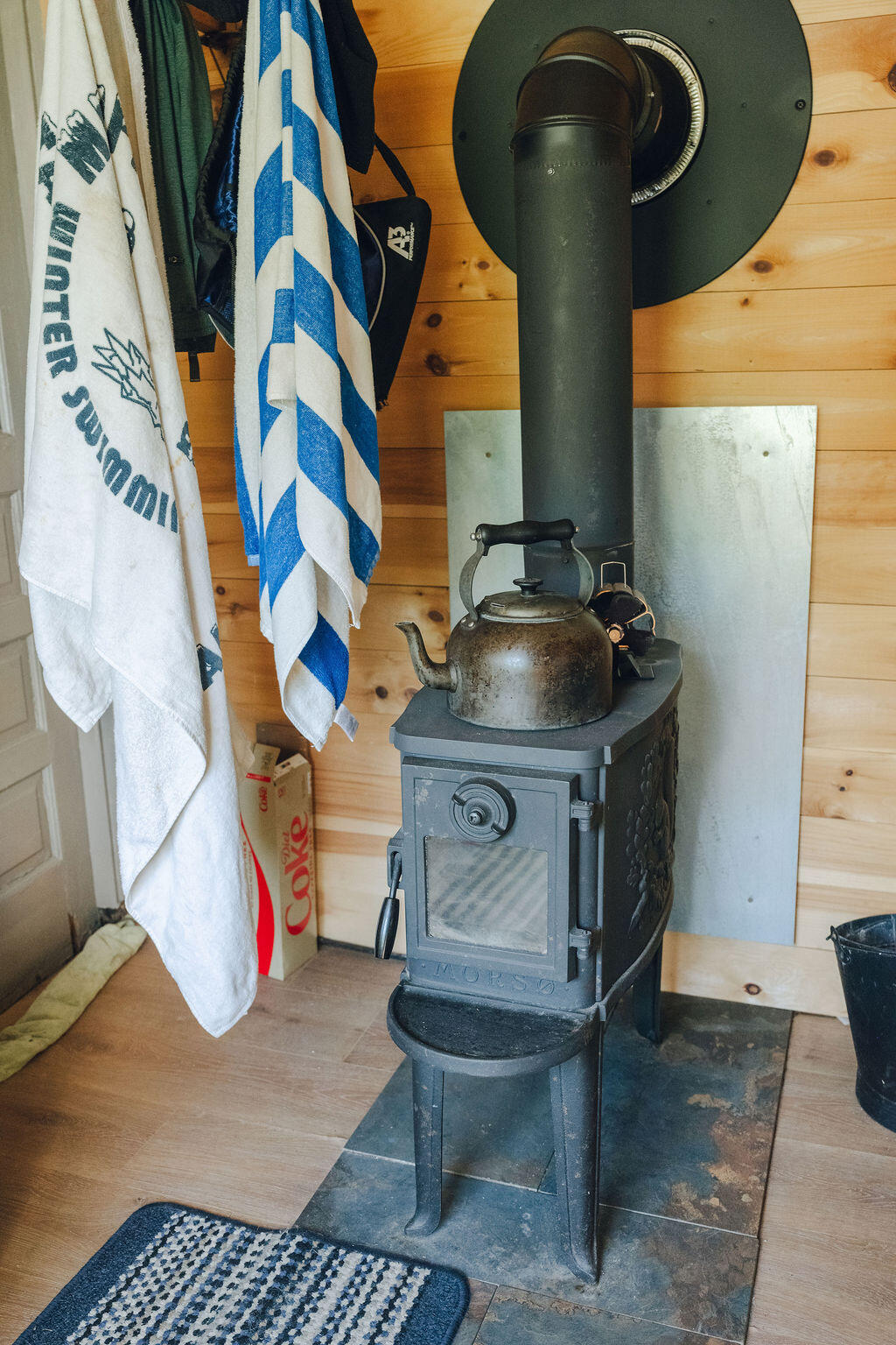 128 Crowley Island Road Gouldsboro, ME 04624 - Photo 31 of 38 Woodstove in Mudroom