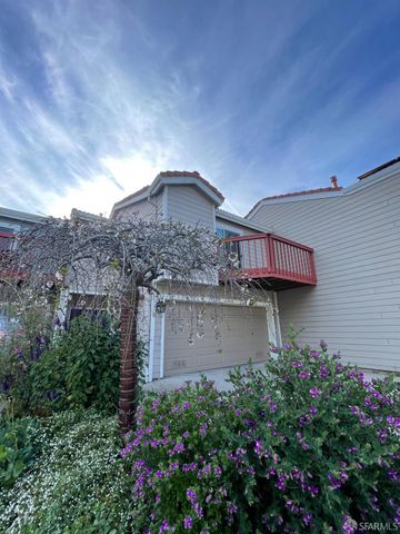 a view of a house with a flower garden