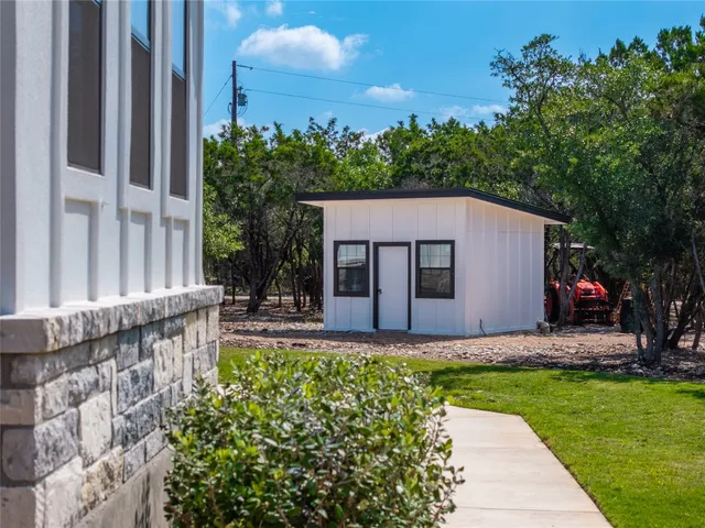 a backyard of a house with lots of green space