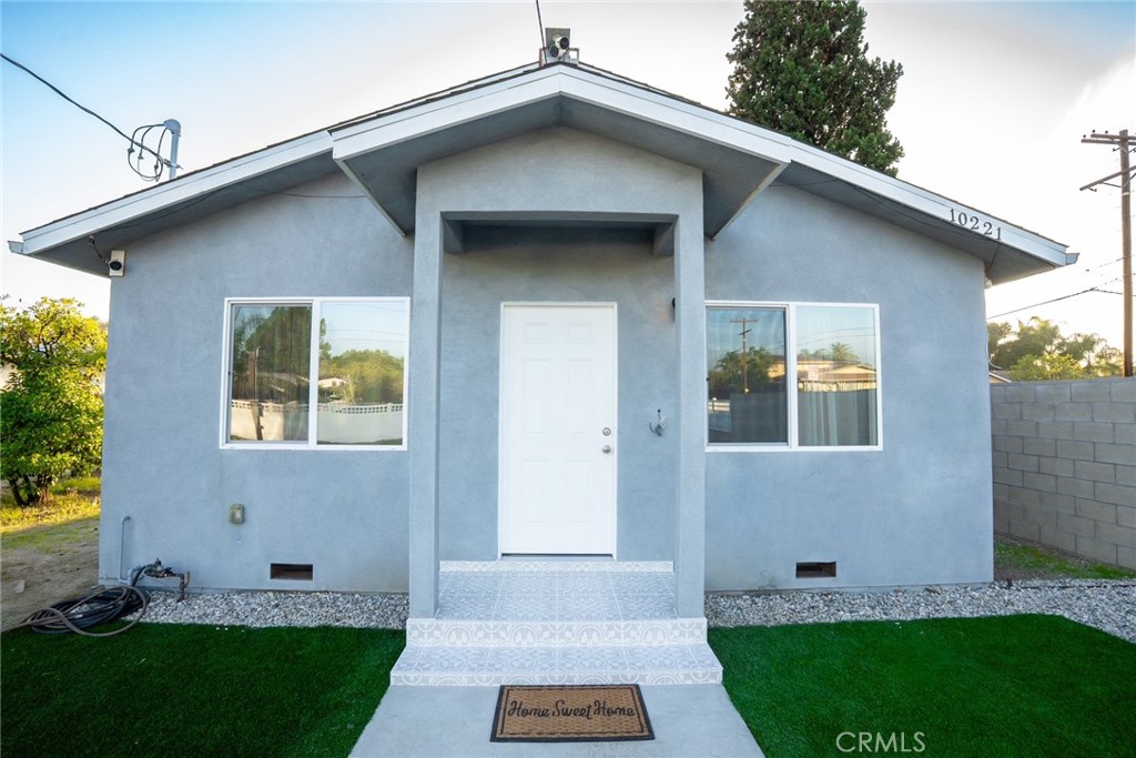 10219 Lev Avenue Arleta, CA 91331 - Photo 3 of 12 a front view of a house with a yard