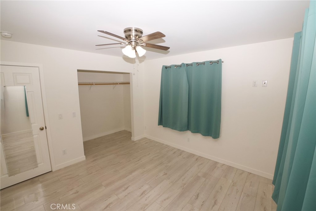 10219 Lev Avenue Arleta, CA 91331 - Photo 9 of 12 wooden floor in an empty room