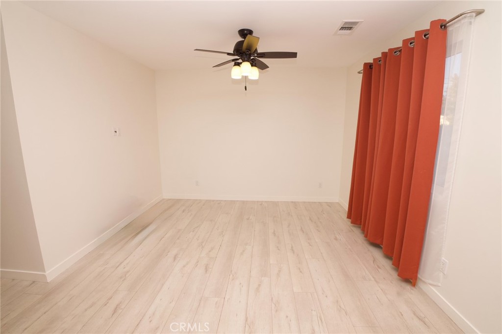 10219 Lev Avenue Arleta, CA 91331 - Photo 10 of 12 a view of a room with a sink and wooden floor