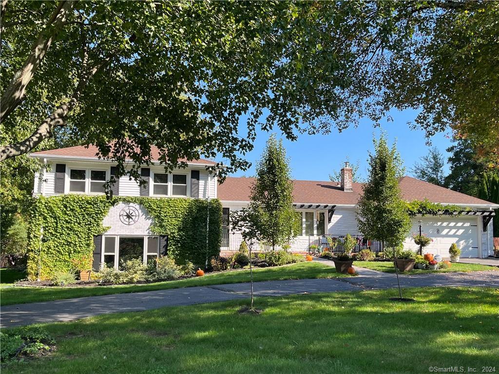 324 Old Mill Road Middletown, CT 06457 - Photo 1 of 1 a front view of a house with a yard