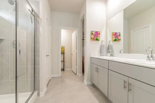 a bathroom with a sink vanity and a mirror
