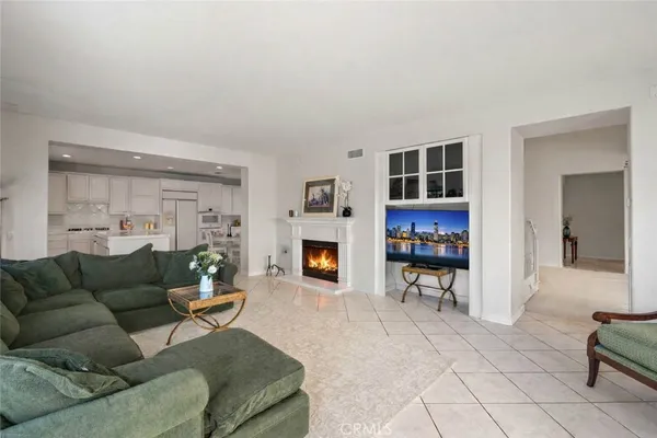 a spacious bedroom with a bed and a couch