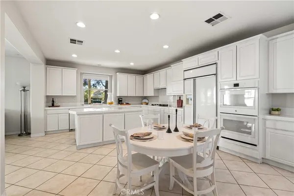 a bedroom with two beds and a window