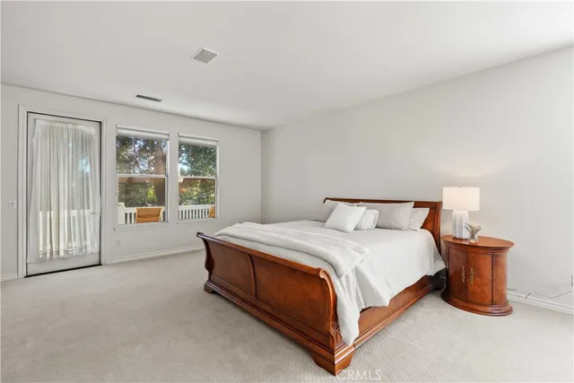 a front view of a house with a lake view