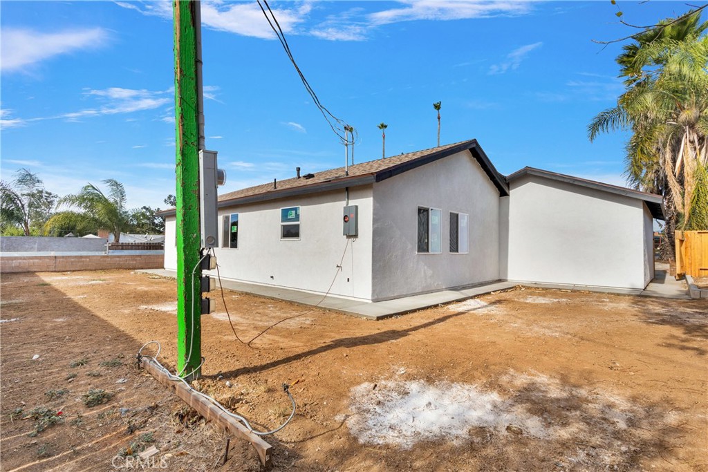 3308 Cannes Avenue Riverside, CA 92501 - Photo 28 of 38 a view of a house with backyard and trees