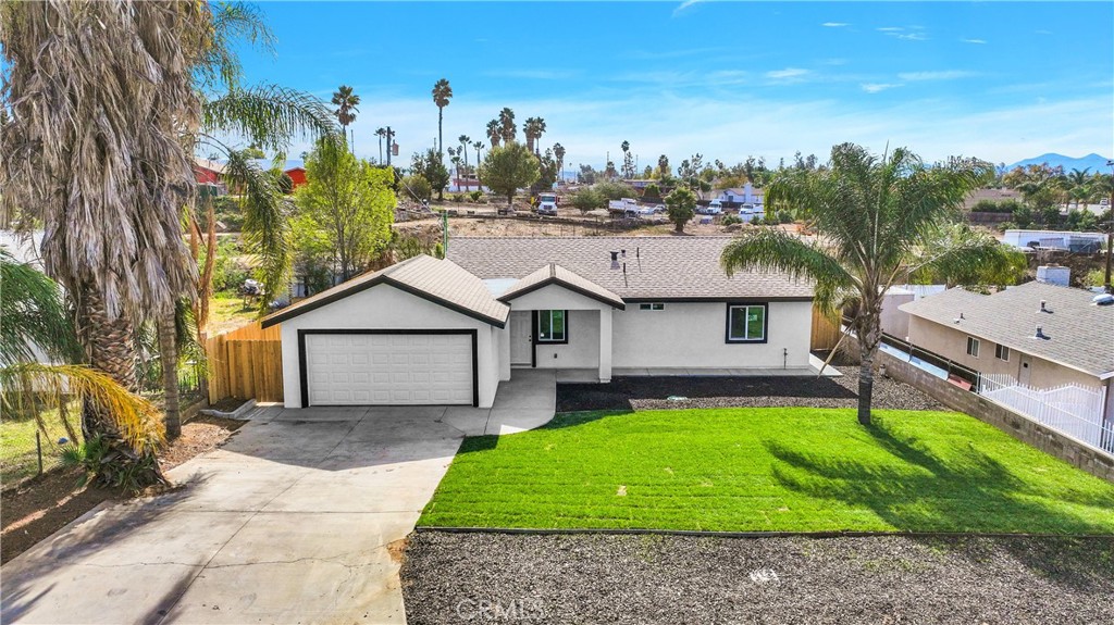 3308 Cannes Avenue Riverside, CA 92501 - Photo 38 of 38 a view of a house with a patio and a yard