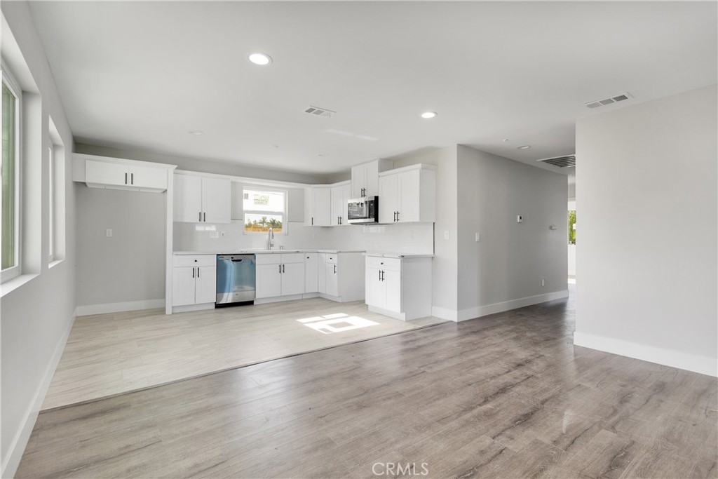 3308 Cannes Avenue Riverside, CA 92501 - Photo 5 of 38 a view of kitchen with refrigerator and window