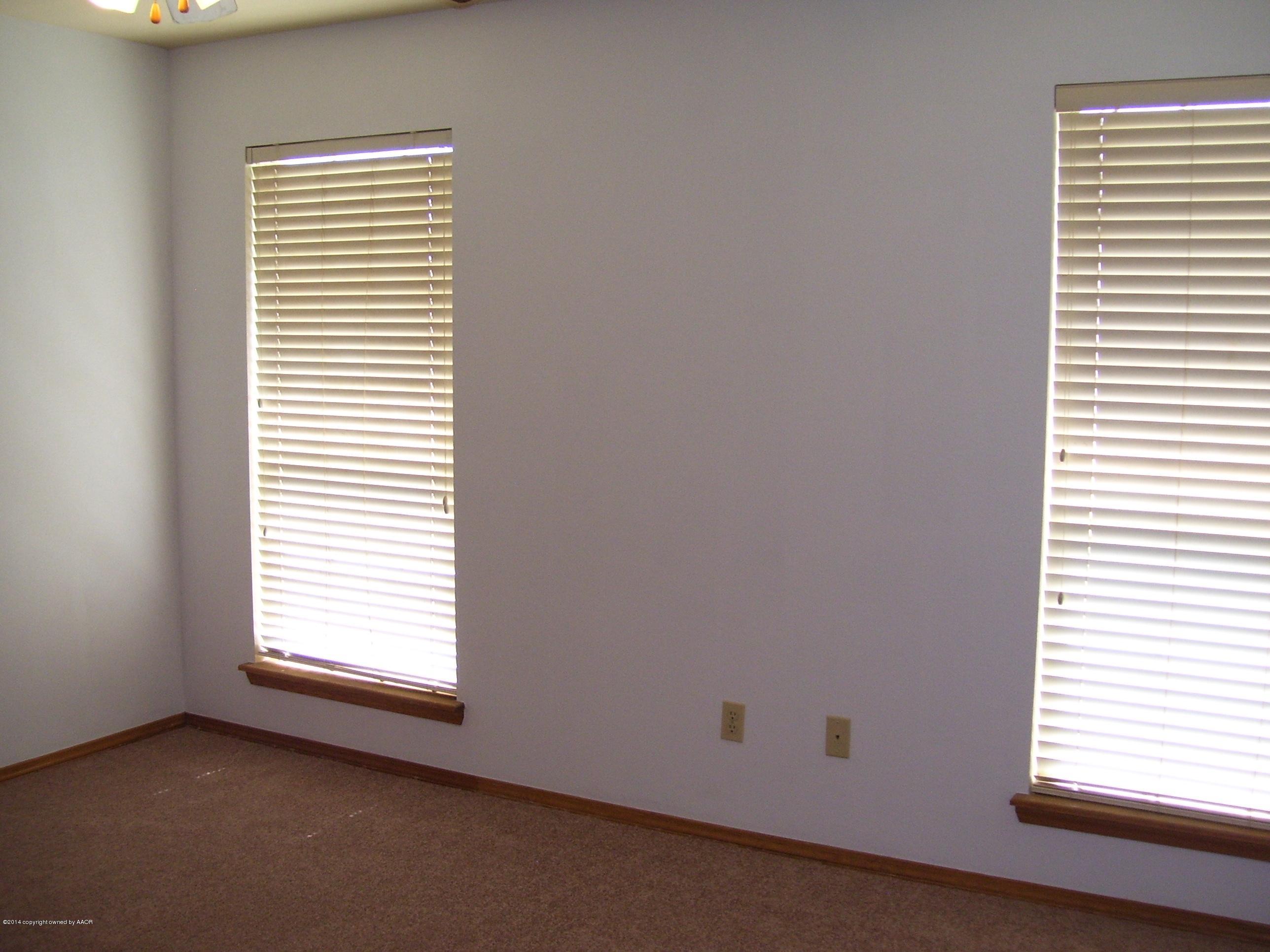 1164 Sterling Drive Amarillo, TX 79110 - Photo 11 of 24 an empty room with a window