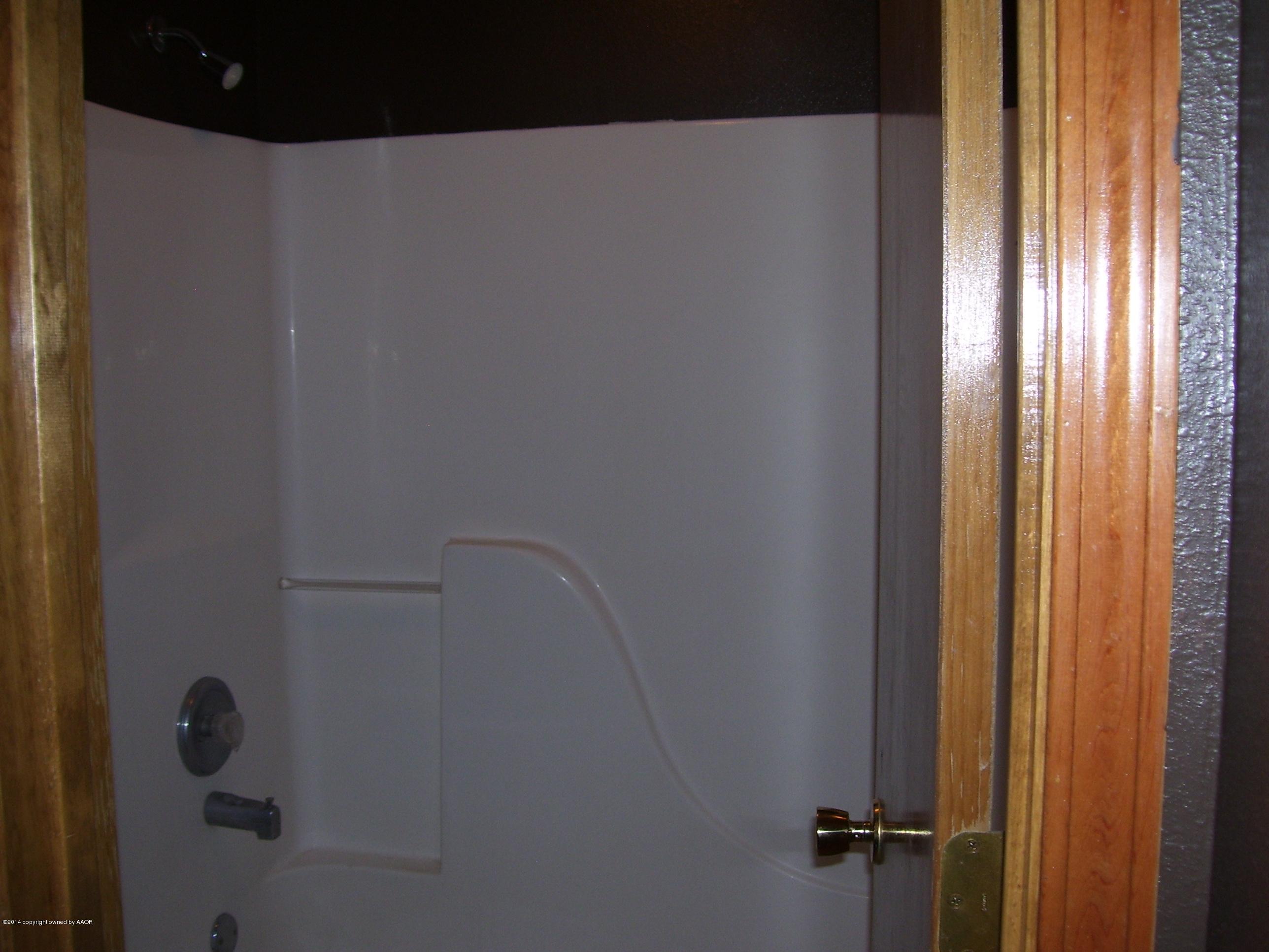 1164 Sterling Drive Amarillo, TX 79110 - Photo 17 of 24 a bathroom with a shower