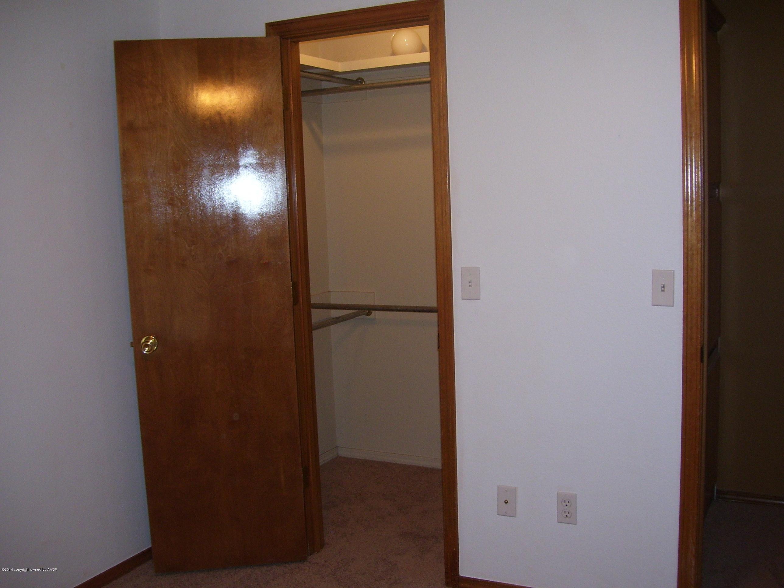 1164 Sterling Drive Amarillo, TX 79110 - Photo 19 of 24 a view of an entryway door with a wooden door