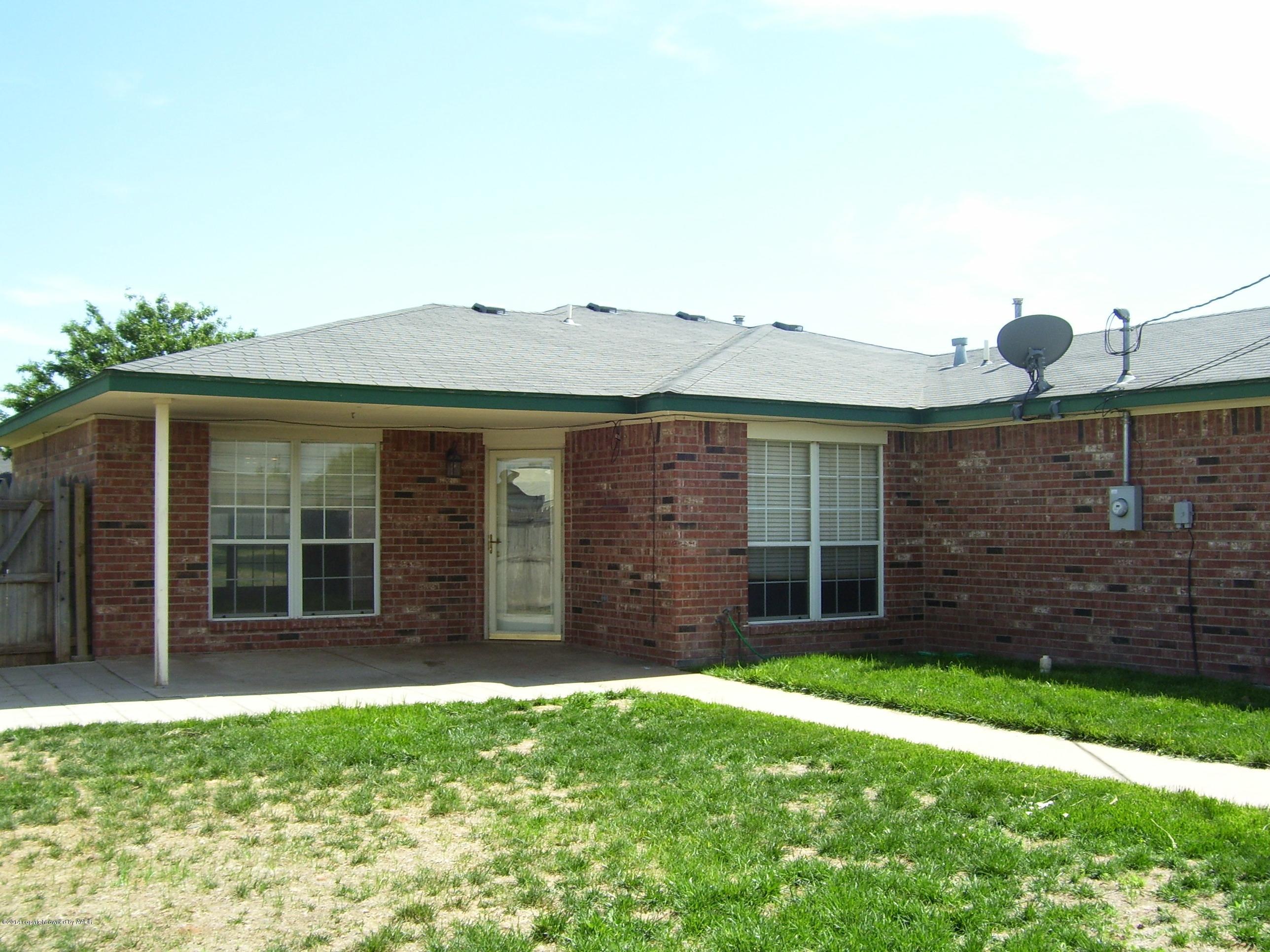 1164 Sterling Drive Amarillo, TX 79110 - Photo 20 of 24 a front view of a house with a garden