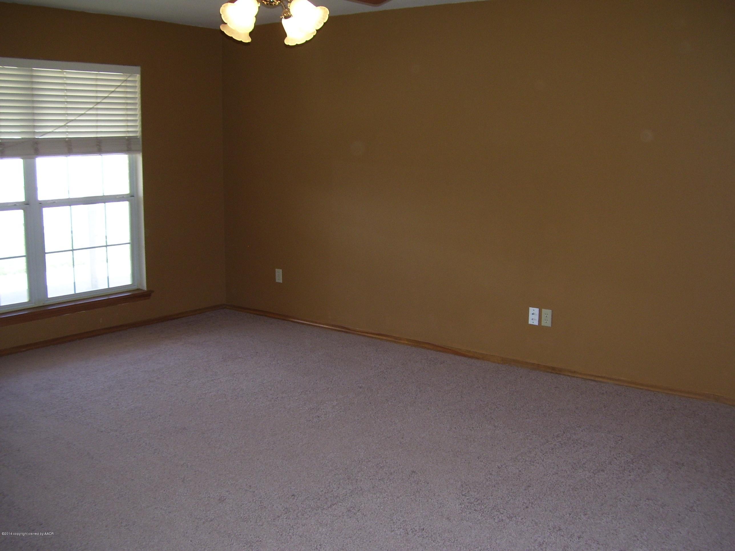 1164 Sterling Drive Amarillo, TX 79110 - Photo 4 of 24 an empty room with windows
