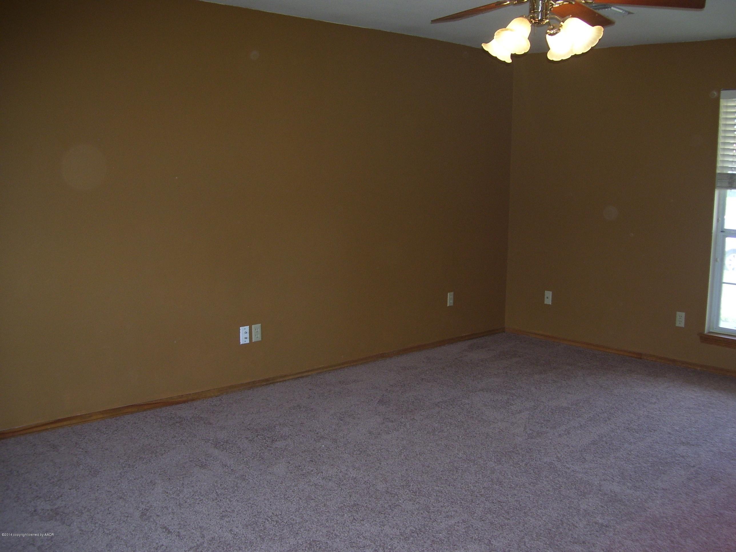 1164 Sterling Drive Amarillo, TX 79110 - Photo 5 of 24 a view of an empty room and a window