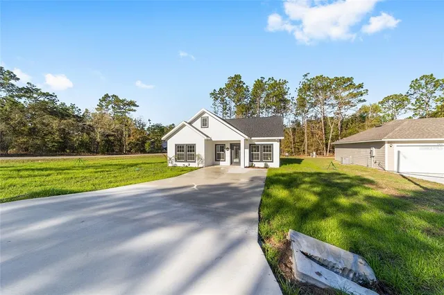 a view of house with outdoor space and street view