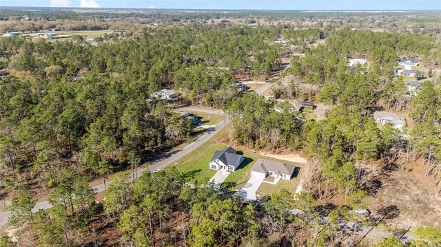 an aerial view of residential house with outdoor space