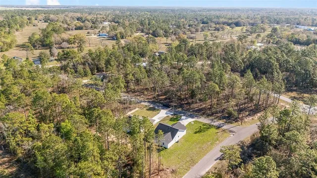 an aerial view of residential house with outdoor space
