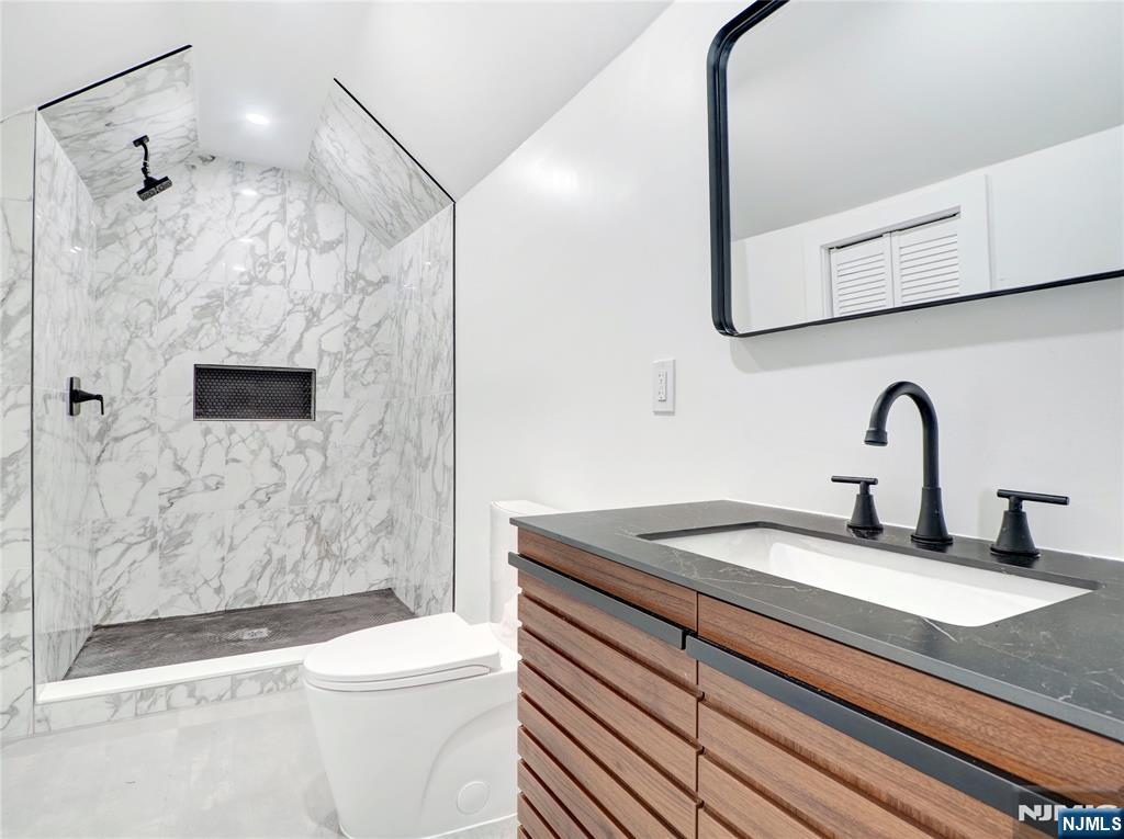 44 Laventhal Avenue Irvington, NJ 07111 - Photo 15 of 26 a bathroom with a sink a toilet and shower