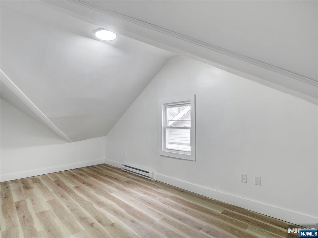 44 Laventhal Avenue Irvington, NJ 07111 - Photo 16 of 26 wooden floor in an empty room