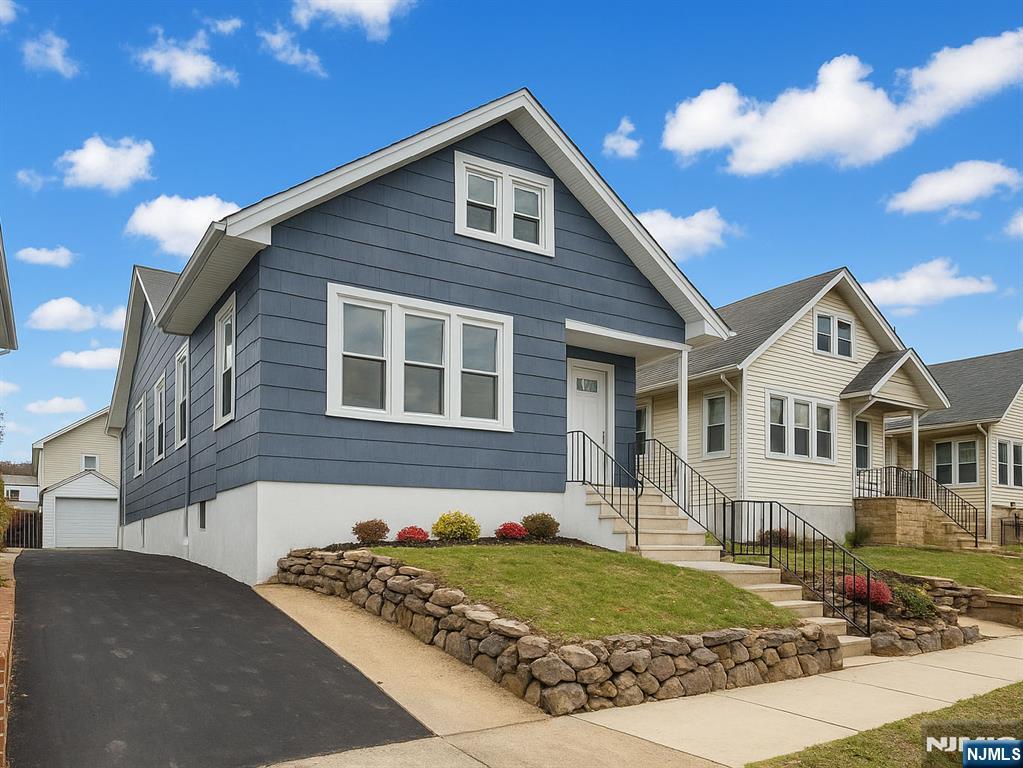 44 Laventhal Avenue Irvington, NJ 07111 - Photo 2 of 26 a front view of a house with a yard