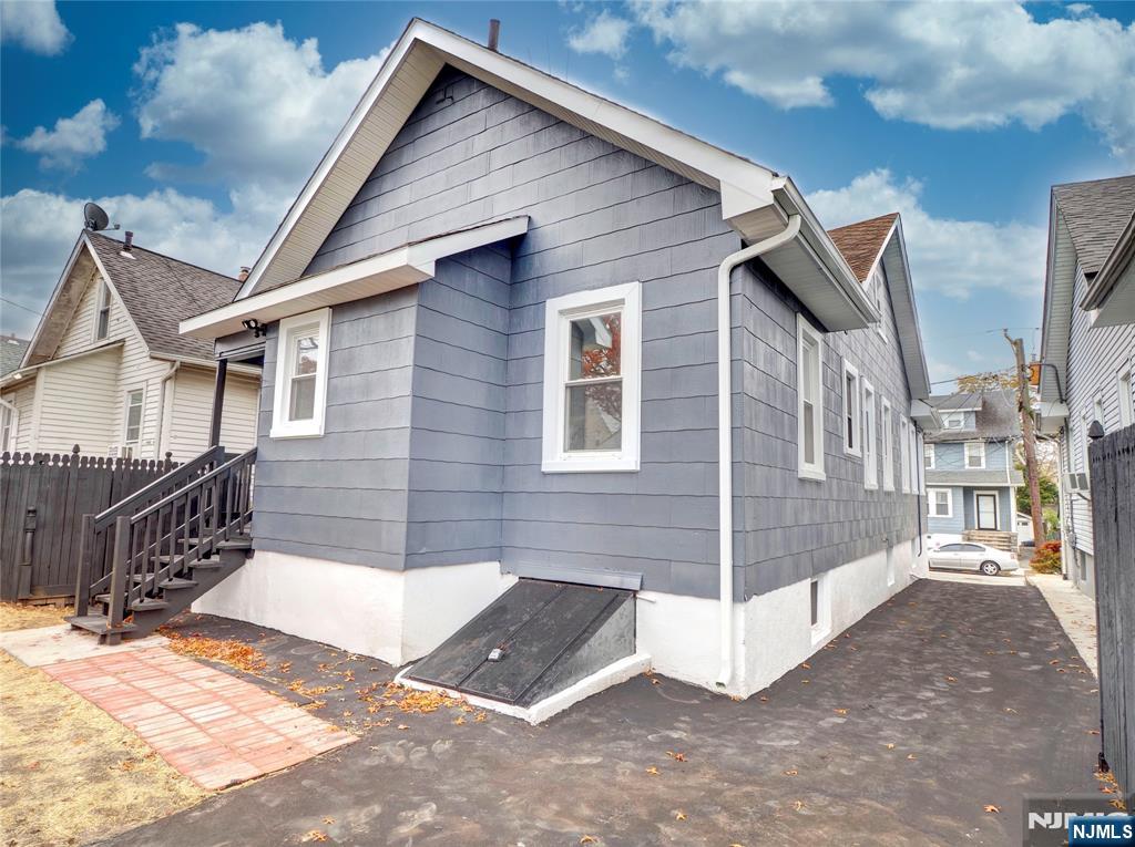 44 Laventhal Avenue Irvington, NJ 07111 - Photo 23 of 26 a view of a house with a wooden fence