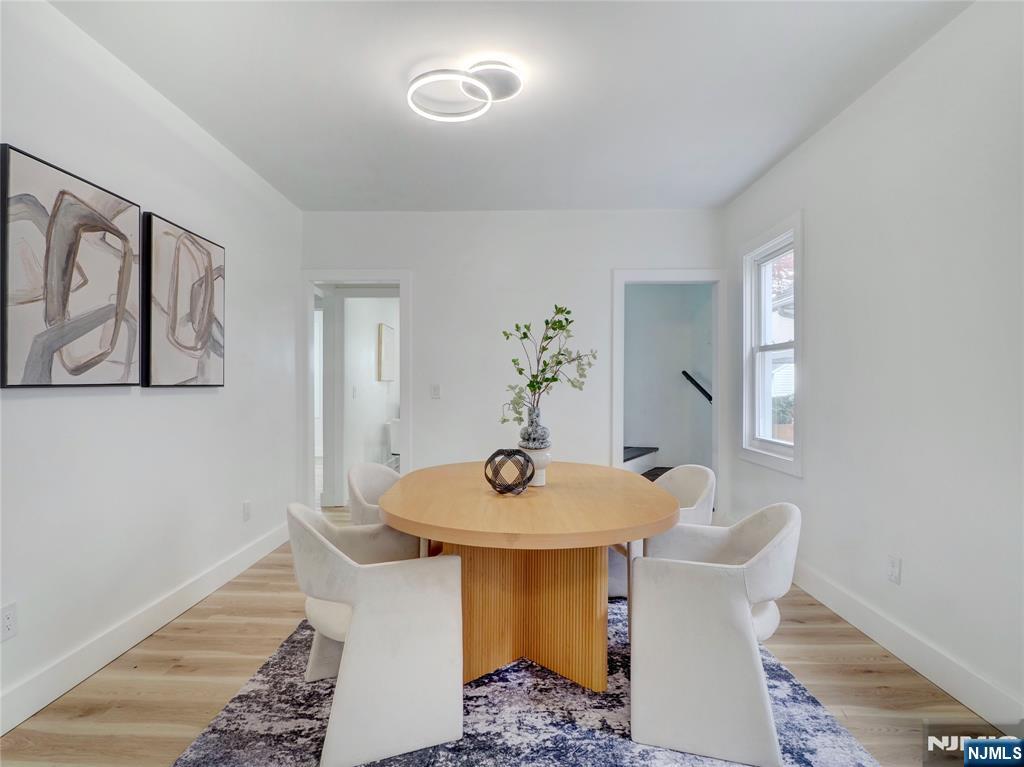 44 Laventhal Avenue Irvington, NJ 07111 - Photo 6 of 26 a dining room with table and hallway