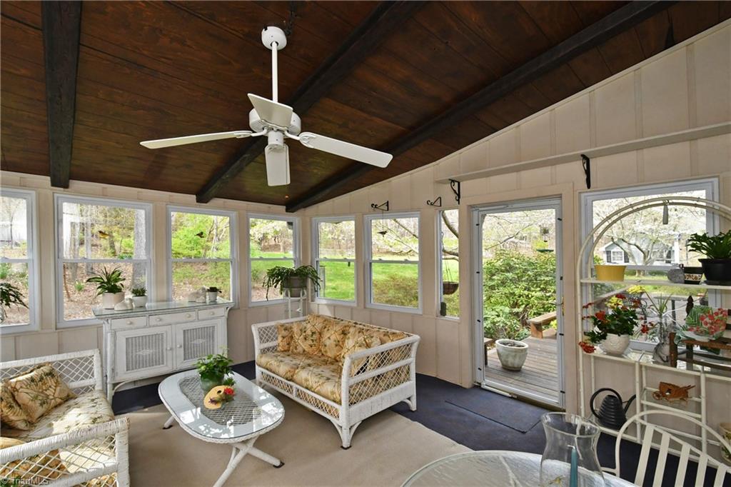225 Cook Street Rural Hall, NC 27045 - Photo 23 of 30 Lovely Sunroom with its vaulted ceiling offers the perfect spot for quiet time, reading. enjoying the wildlife and the views.