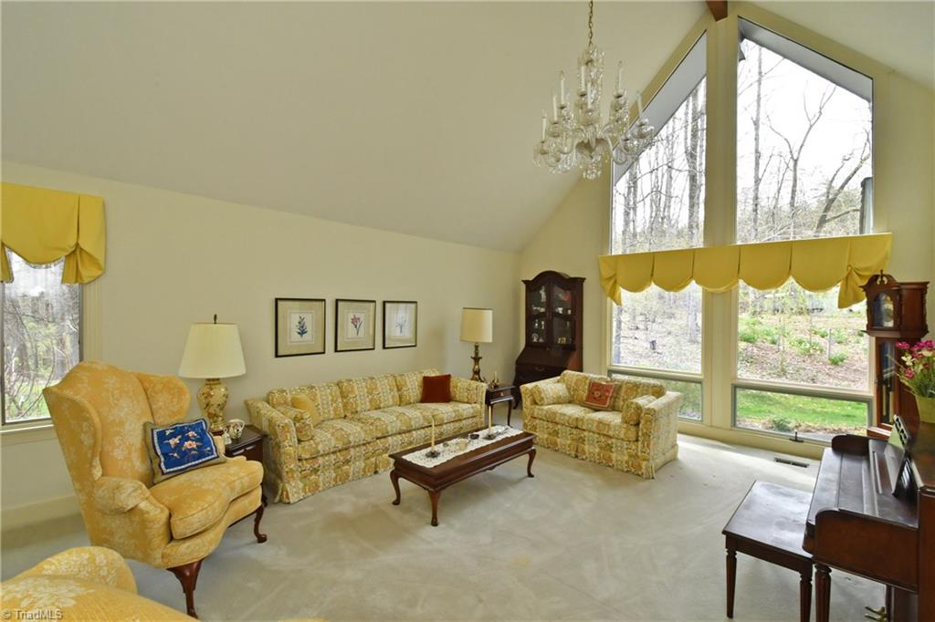 225 Cook Street Rural Hall, NC 27045 - Photo 6 of 30 The living room's cathedral ceiling makes the most of the natural light and nature's perfect view.