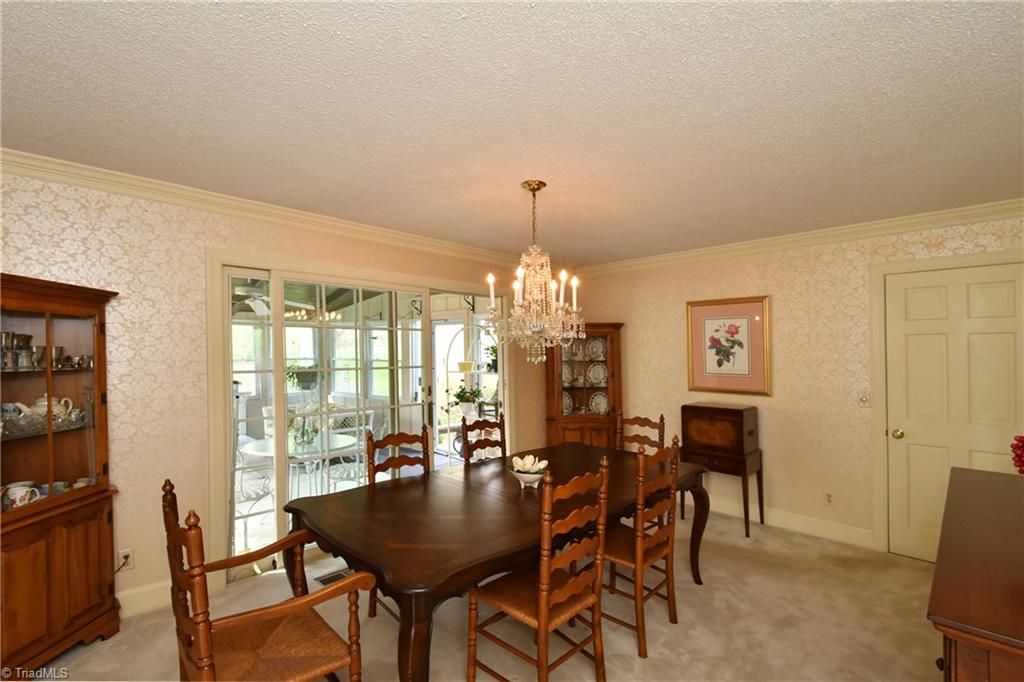 225 Cook Street Rural Hall, NC 27045 - Photo 8 of 30 Just picture your family gathering around the table for holiday dinners in this spacious dining room off the sunroom.