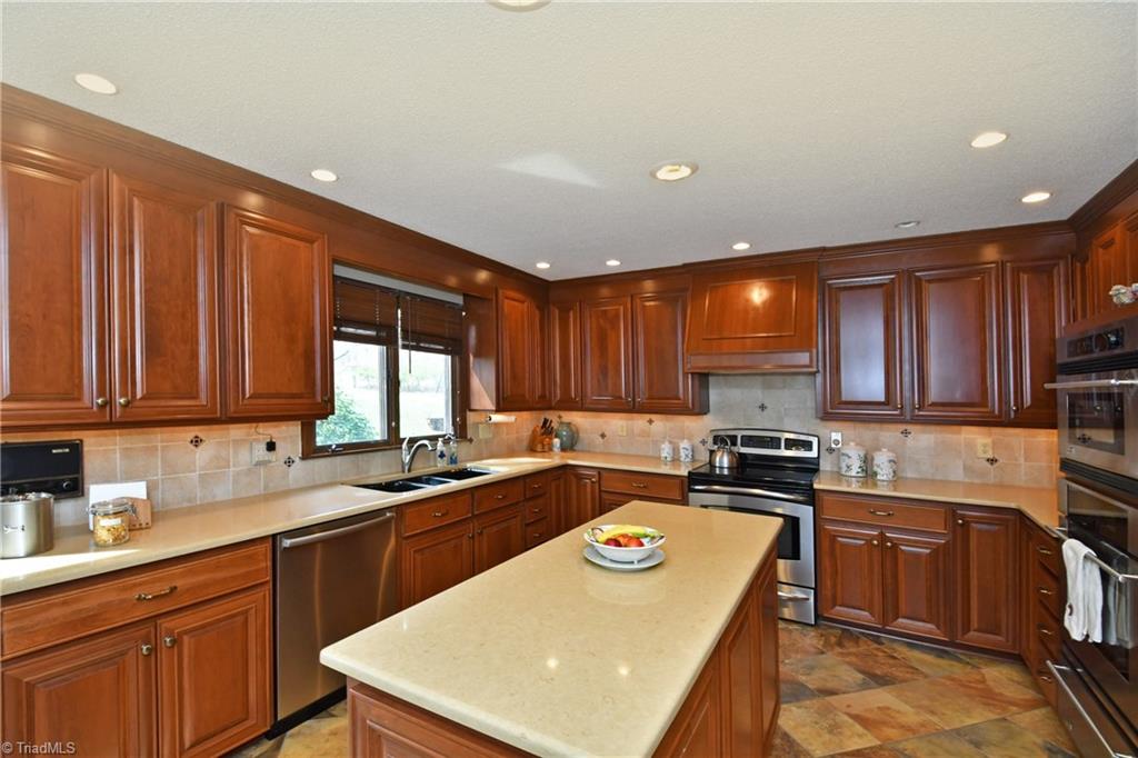 225 Cook Street Rural Hall, NC 27045 - Photo 9 of 30 Enjoy cooking in the fully updated gourmet kitchen with its abundant cabinetry and very high-end Stainless steel appliances, including double ovens, a convection microwave, and even a warming drawer!