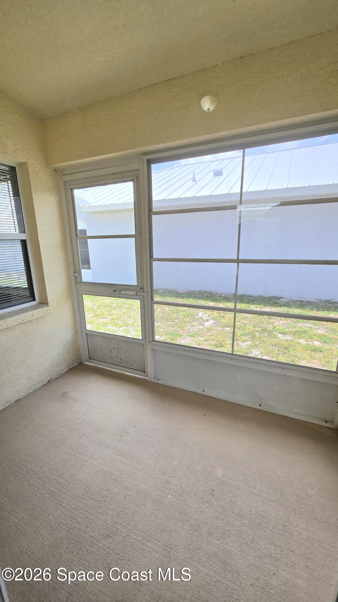 1977 Myrtle Court Palm Bay, FL 32905 - Photo 18 of 19 a view of an empty room and window