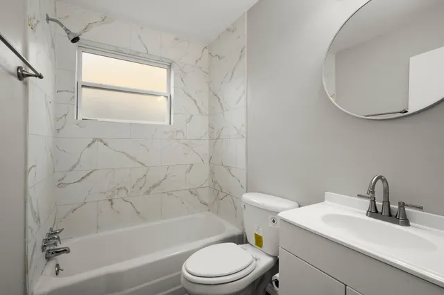 a bathroom with a sink a toilet and a bathtub