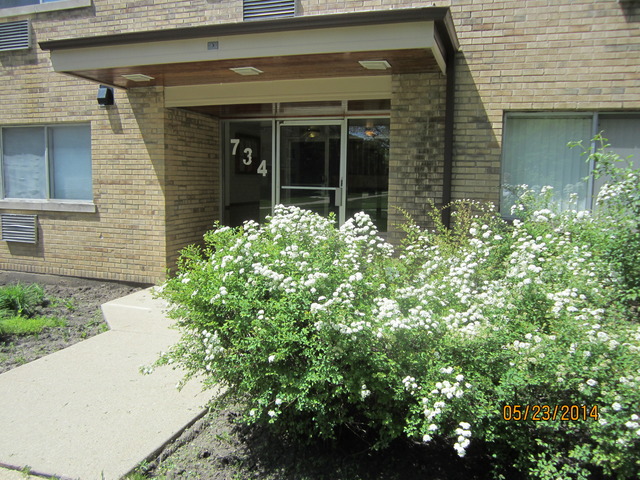 734 Dempster Street, Unit G6 Mount Prospect, IL 60056 - Photo 1 of 1 front view of a brick house with a large window