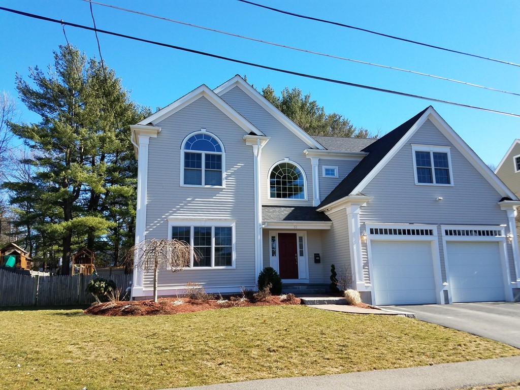 51 Ware Road Needham, MA 02492 - Photo 1 of 14 a front view of a house with garden