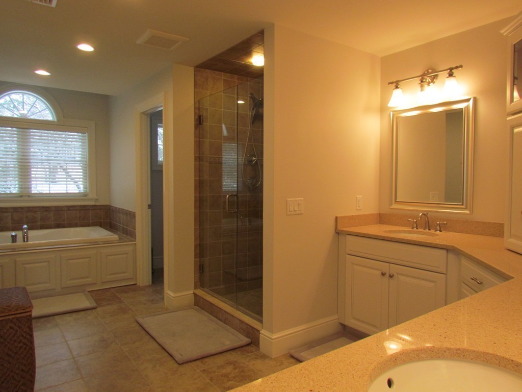51 Ware Road Needham, MA 02492 - Photo 8 of 14 a bathroom with a tub sink shower and mirror