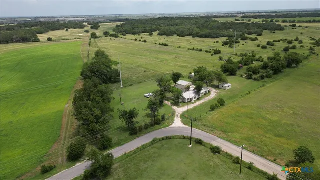 a view of a field with an ocean