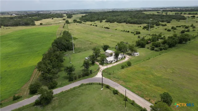 a view of a lake with a yard