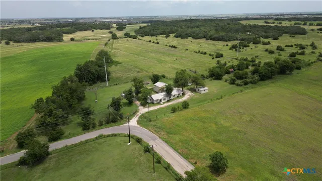 a view of a lake with a yard