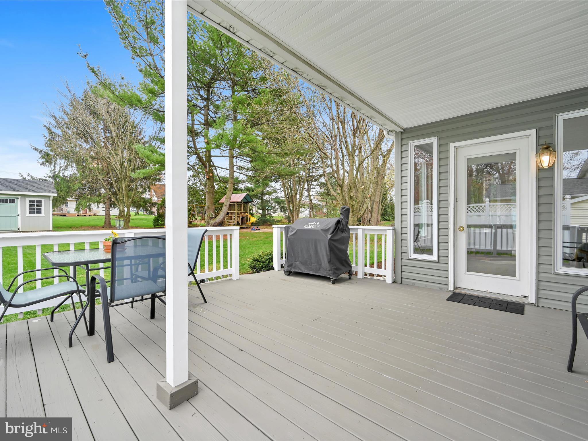 28 Buttonwood Drive Lititz, PA 17543 - Photo 26 of 32 a view of a deck with table and chairs and wooden floor