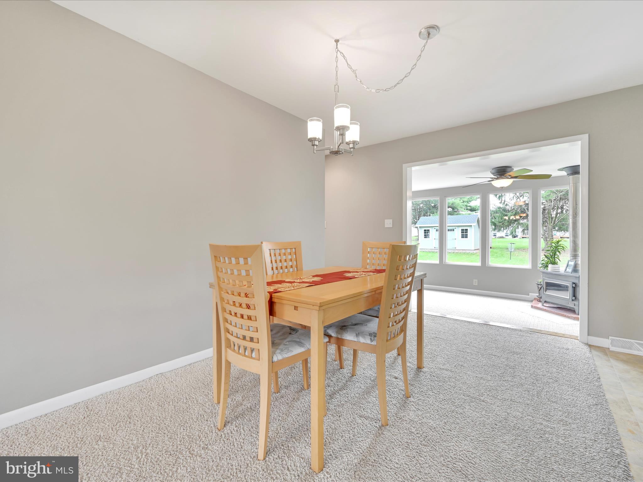 28 Buttonwood Drive Lititz, PA 17543 - Photo 6 of 32 a view of a dining room with furniture wooden floor and chandelier