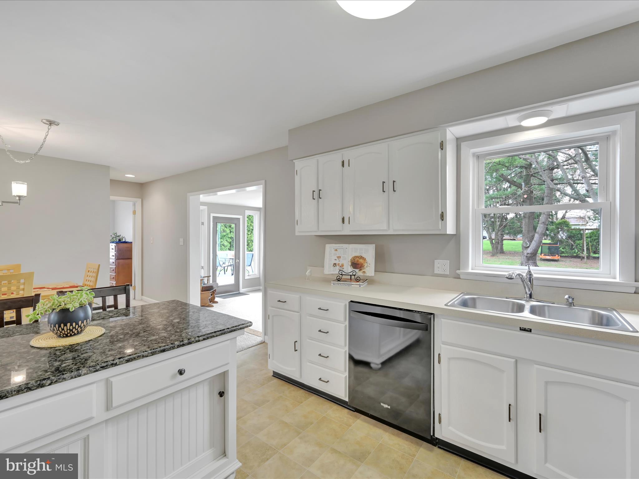 28 Buttonwood Drive Lititz, PA 17543 - Photo 10 of 32 a kitchen with granite countertop a sink stainless steel appliances white cabinets and a window