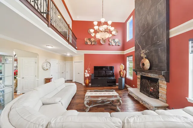 a bed sitting in a bedroom next to a window with pc on the wall