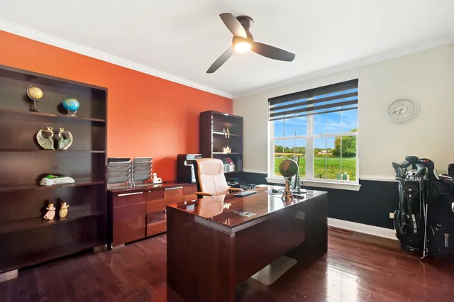 a bathroom with a granite countertop sink toilet and mirror