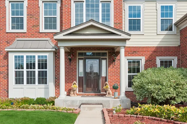a view of entryway dining room and hall with wooden floor
