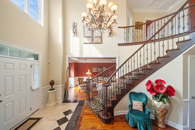 a view of entryway livingroom and hall with wooden floor