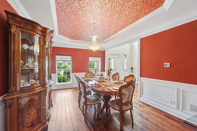 a kitchen with stainless steel appliances granite countertop granite counter tops refrigerator a oven and large wooden cabinets