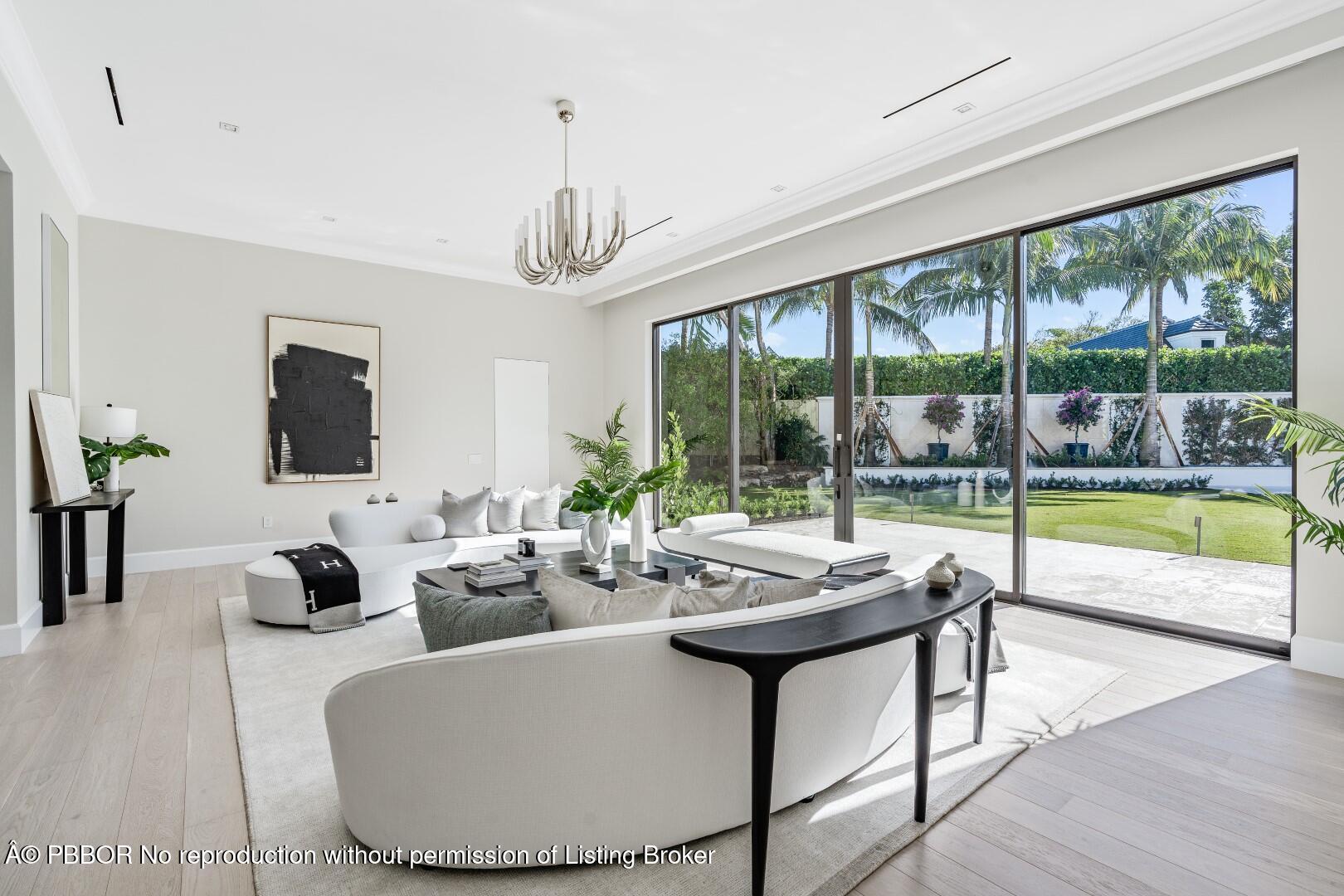 150 El Vedado Road Palm Beach, FL 33480 - Photo 12 of 77 a outdoor space with furniture and large windows