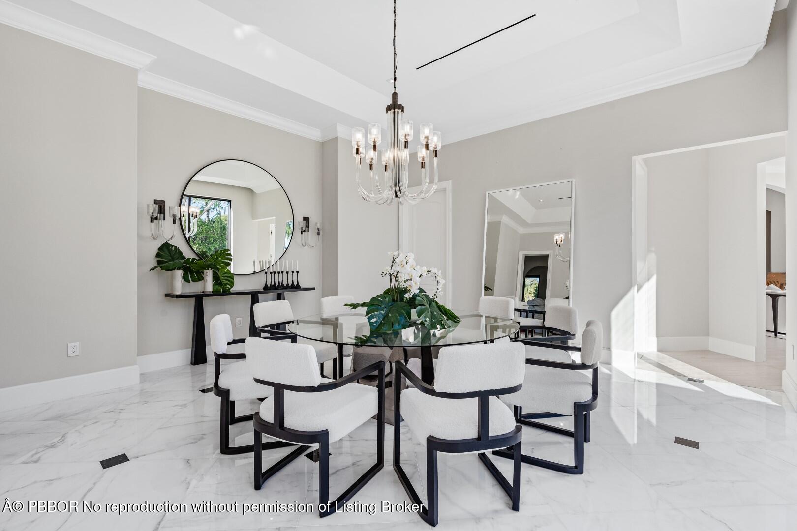 150 El Vedado Road Palm Beach, FL 33480 - Photo 13 of 77 a dining room with furniture a chandelier and wooden floor